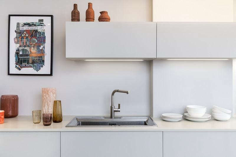 A glass fronted streamlined galley kitchen portrait 3 9
