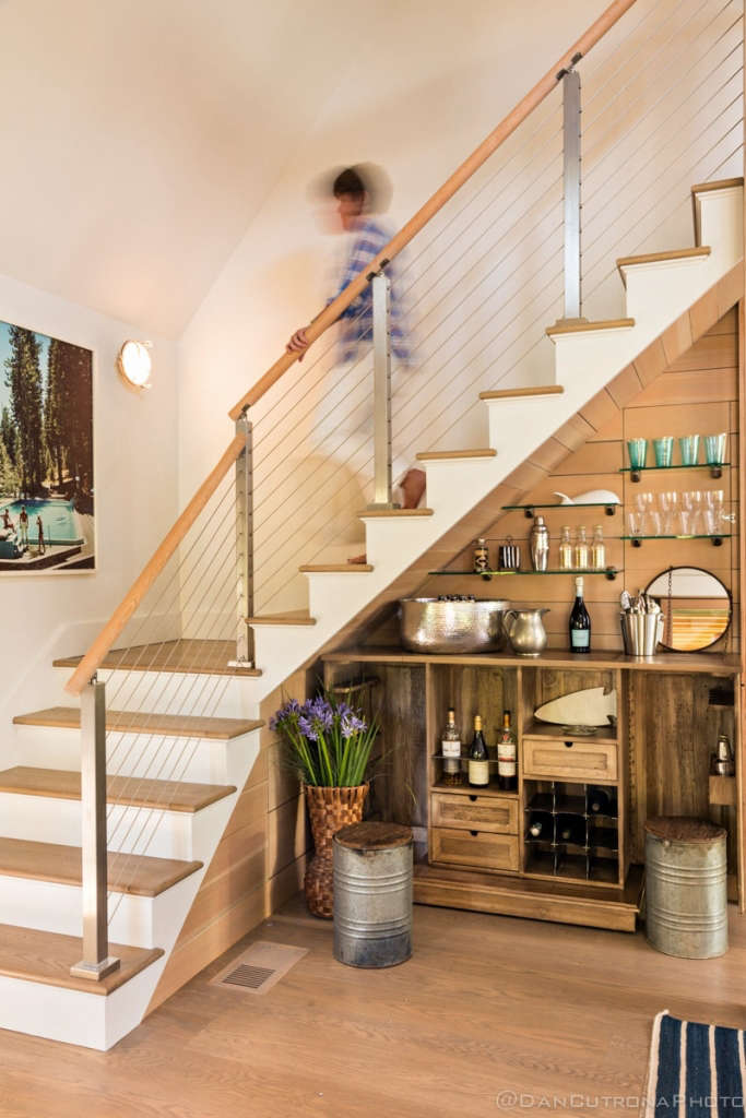 the perfect modern stairway hovers over custom bar 11