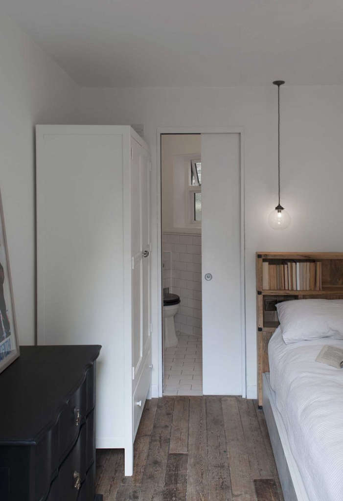 compact bedroom and bathroom extension with a connecting glass corridor. 7