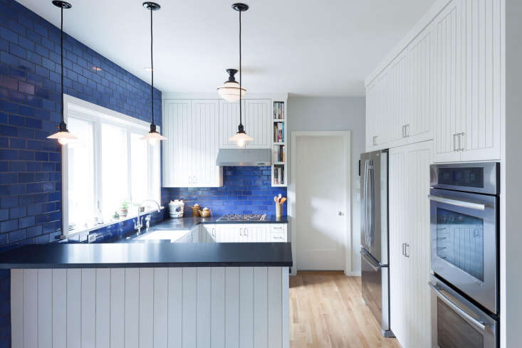 in the remodel of this u shaped kitchen in portland, oregon, opal blue til 24