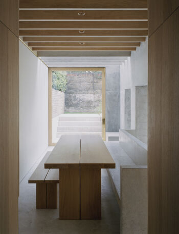 islington house dining room with custom table and concrete bench by mclaren excell
