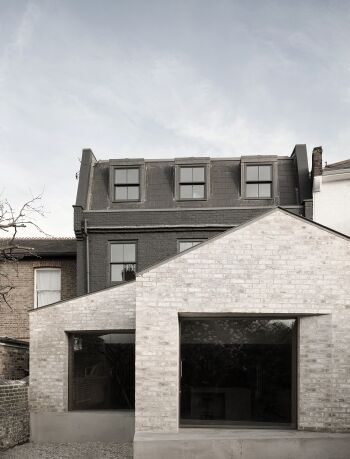 kew house exterior rear view of extension and black and light brick facade by mclaren excell