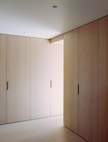 underwood light oak flooring and wardrobe custom storage system by mclaren excell